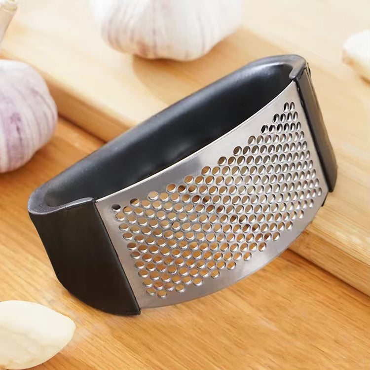 Premium stainless steel garlic press showcasing its smooth surface and user-friendly design