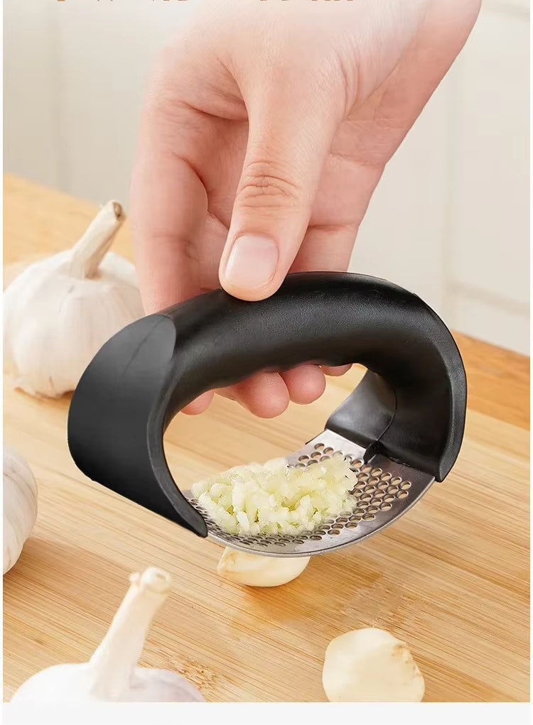 Stainless steel garlic press crushing garlic cloves smoothly and efficiently