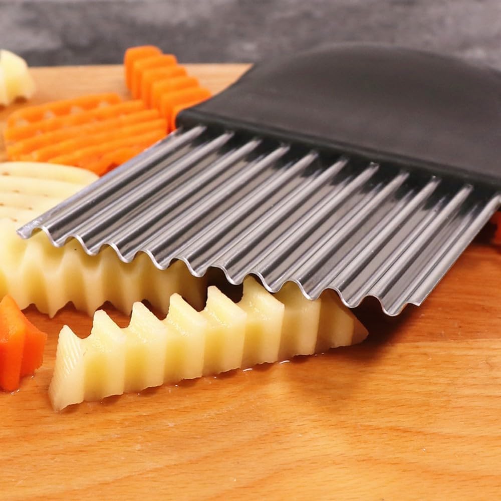 Close-up of sharp stainless steel blade on potato chip slicer for crinkle and wavy cuts