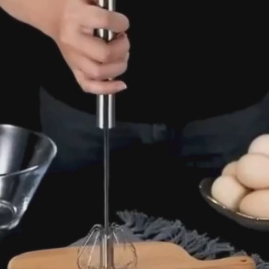 Demonstration of the Stainless Steel Egg Beater whisking eggs and cream with smooth, semi-automatic motion.