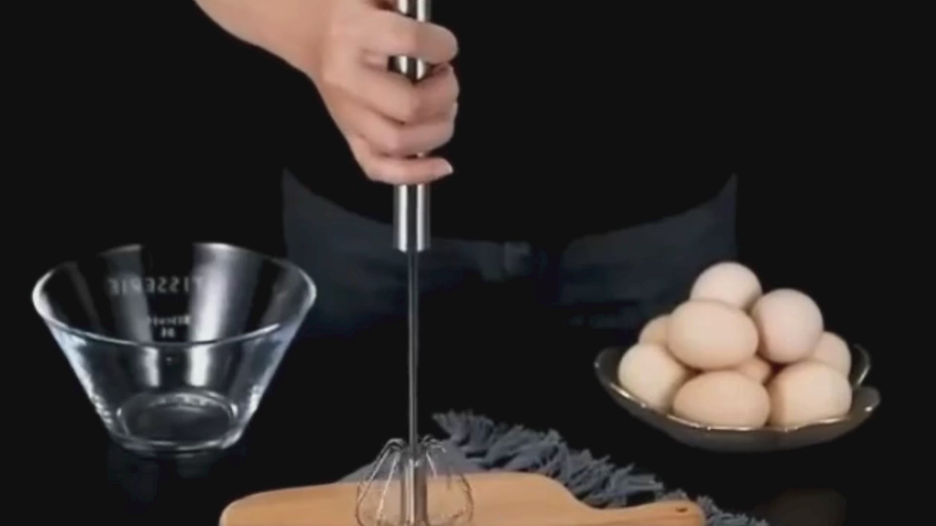 Demonstration of the Stainless Steel Egg Beater whisking eggs and cream with smooth, semi-automatic motion.